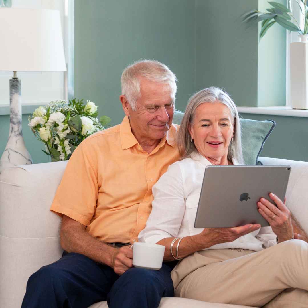 A couple looking at an iPad together