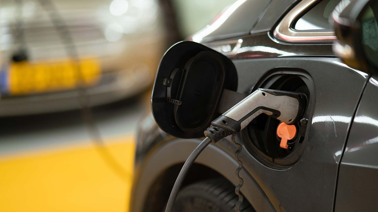 A photo of an electric car being charged