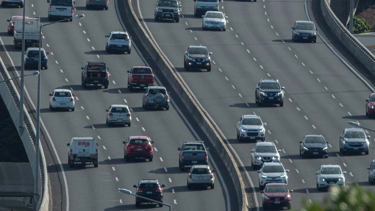A photo of a motorway with cars and vans