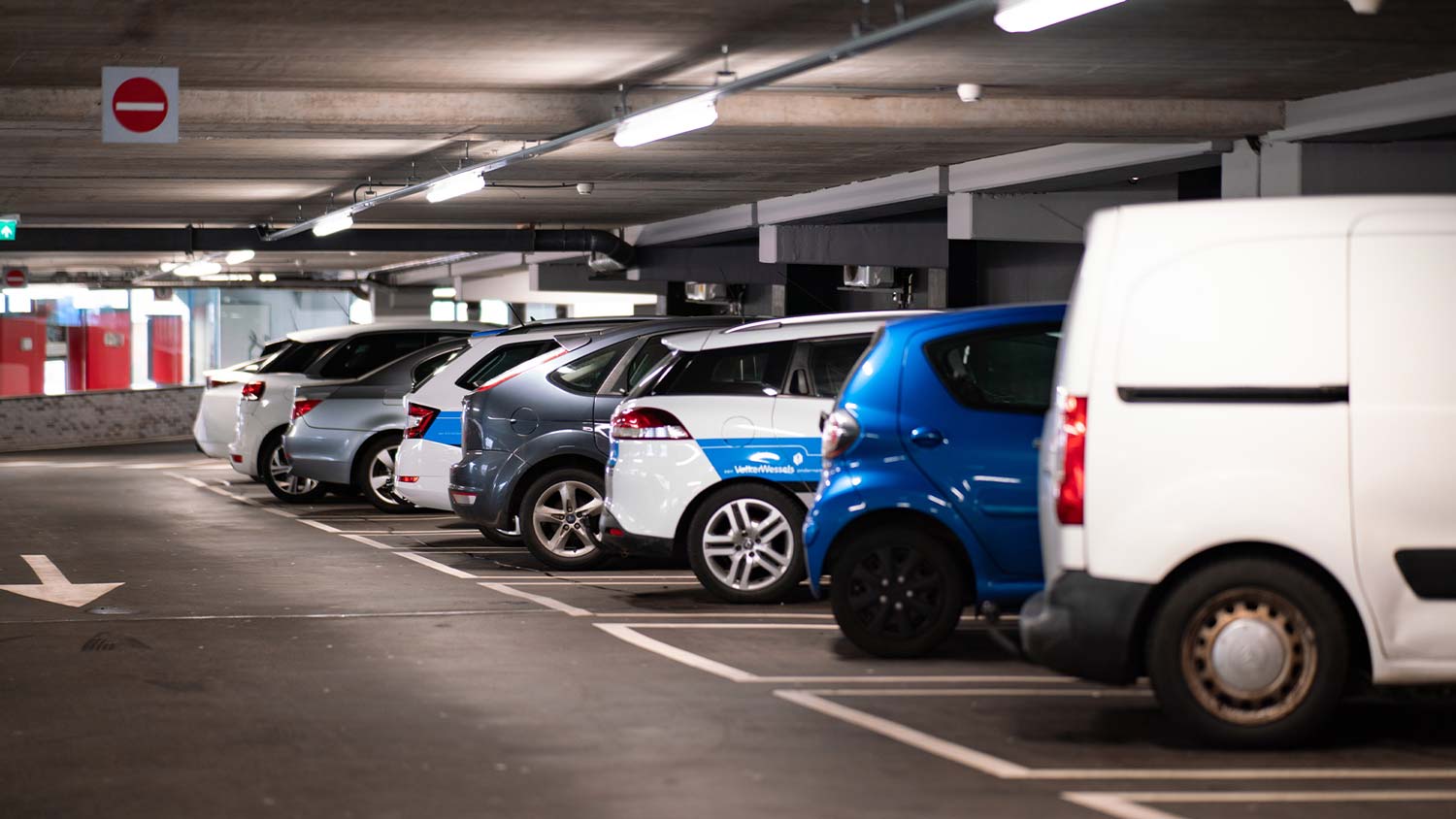 A car park full of cars and vans