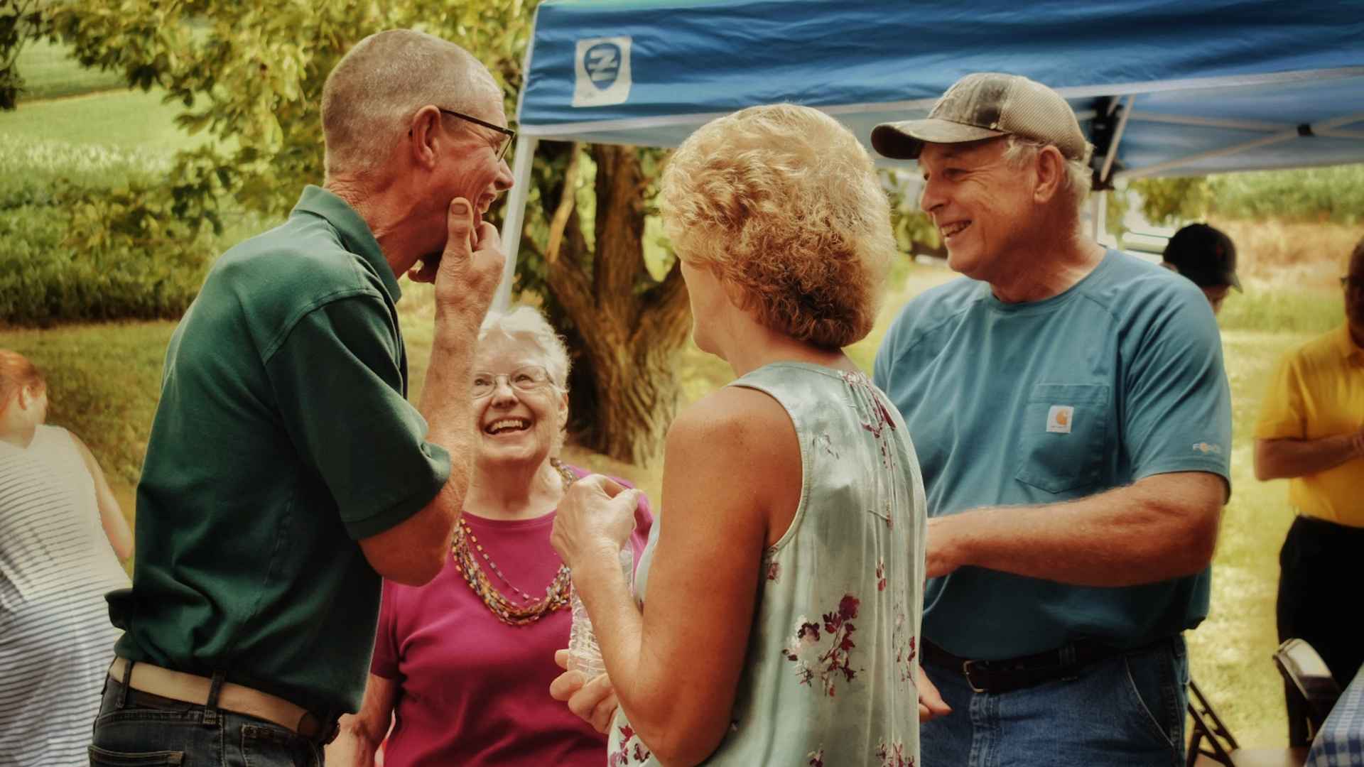 A group of people talking at an event