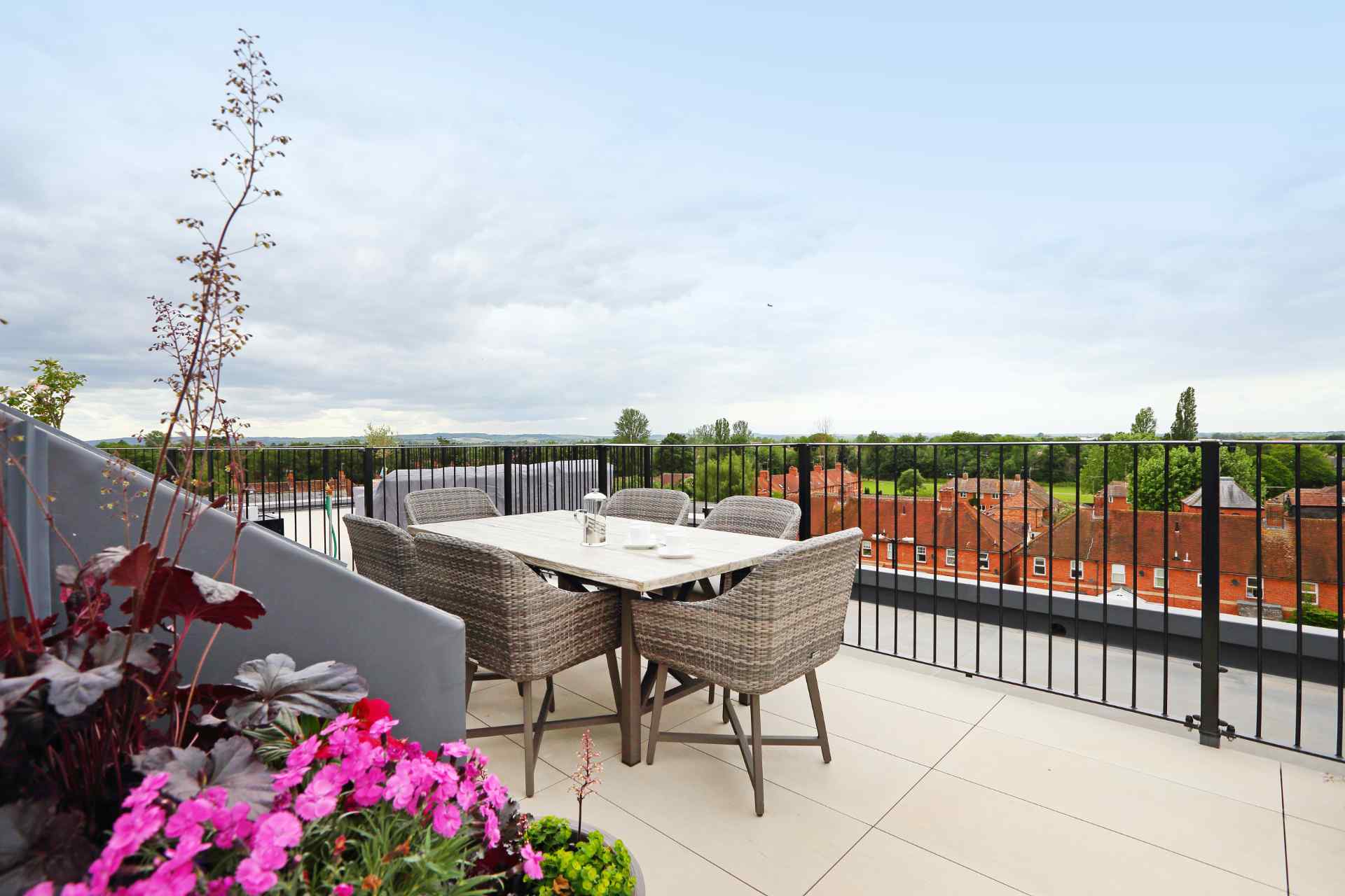 A balcony with potted plants