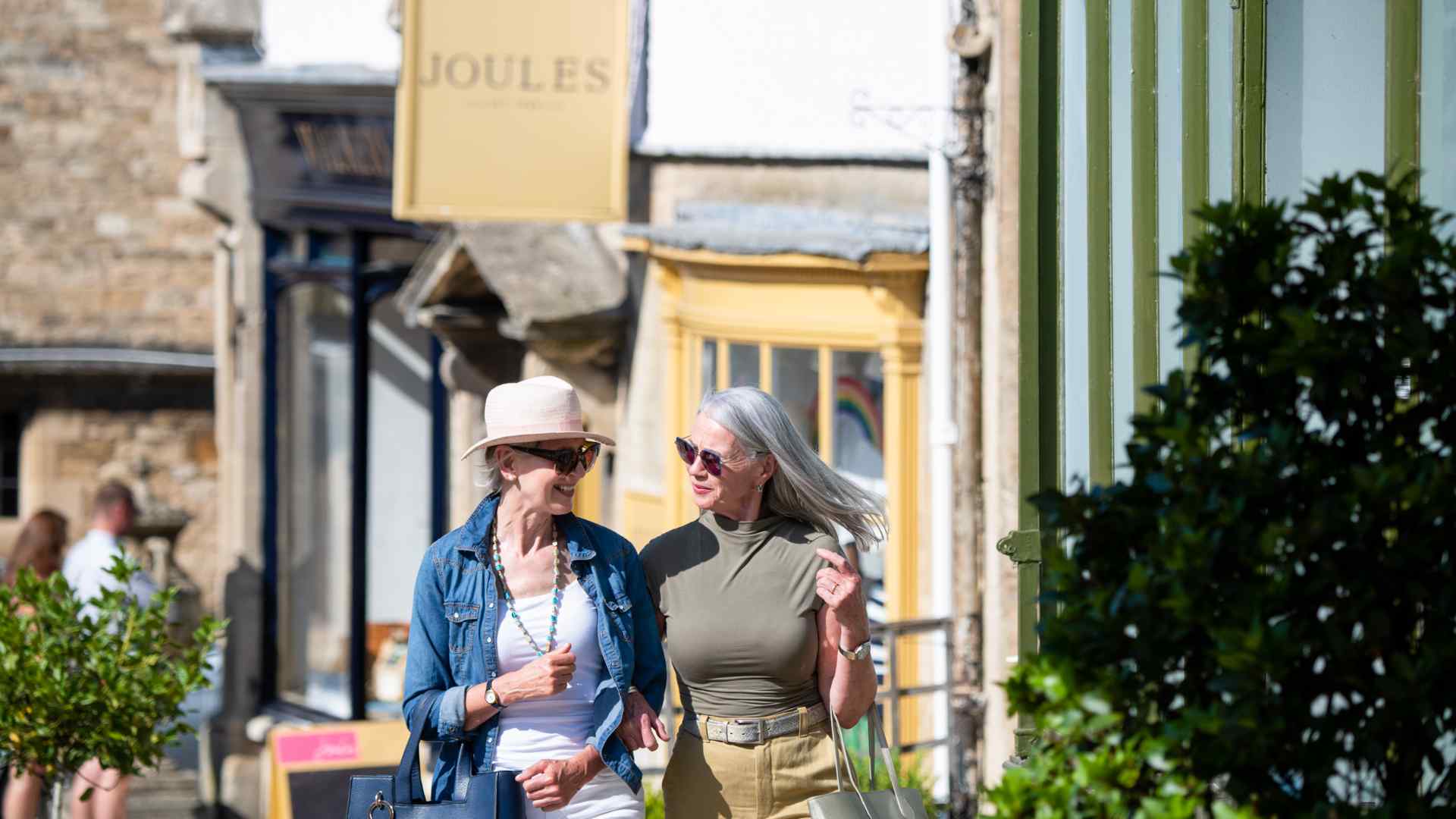 Two women shopping on Burford high street.