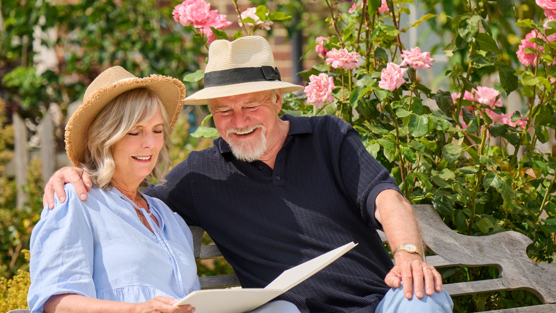 Older couple sharing a warm moment together in a landscaped garden