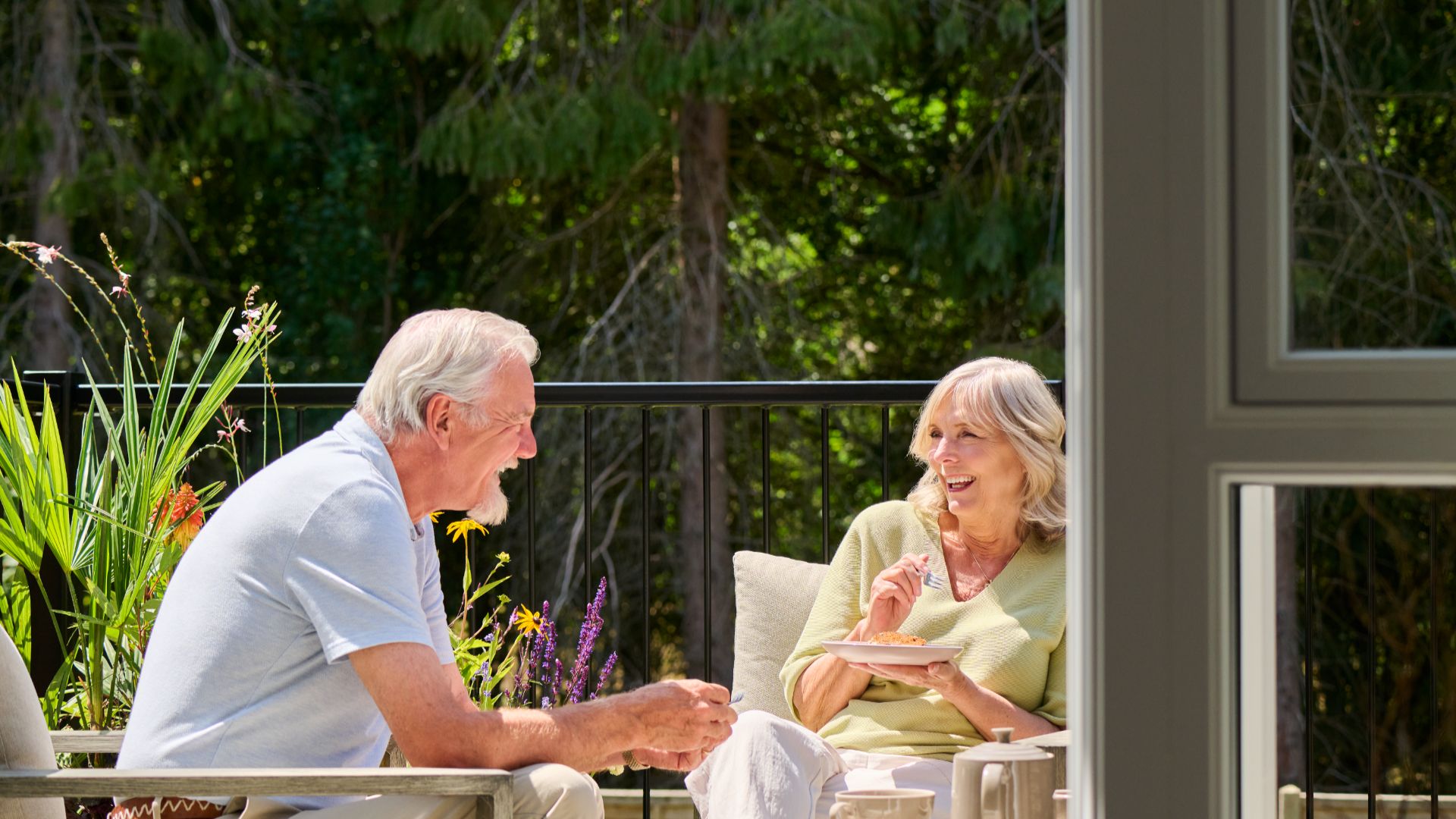 A couple sat on a balcony