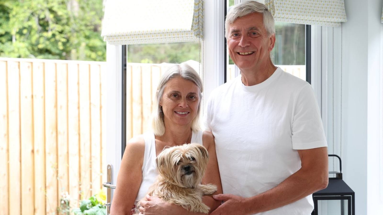 Rick and Cathy White with their dog inside their Manor Gardens home in Shiplake