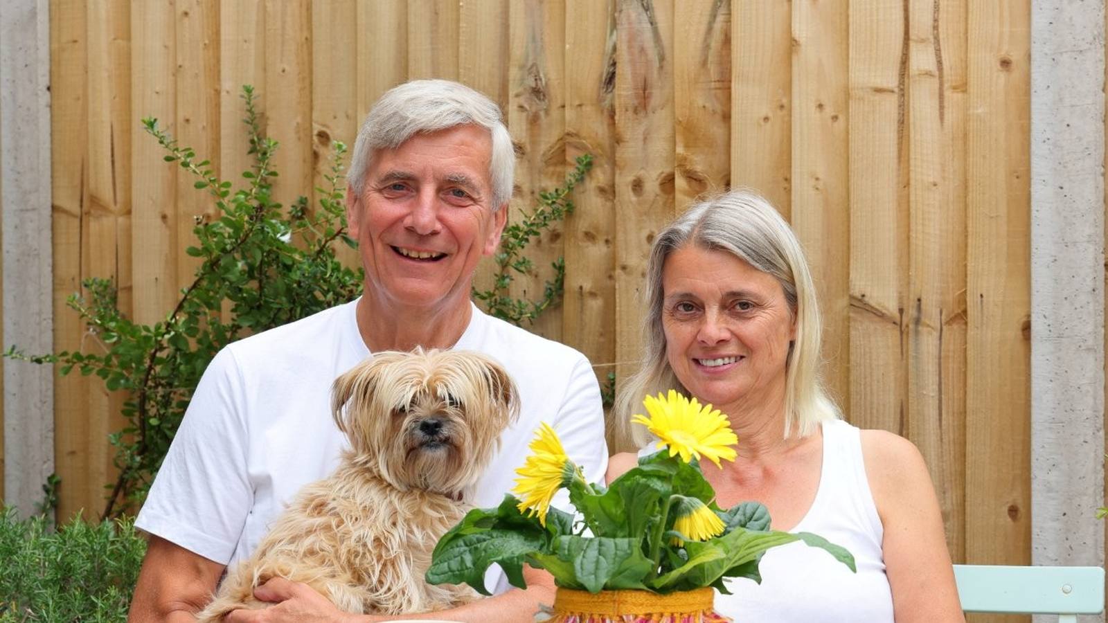 Rick and Cathy White with their dog in the garden at Manor Gardens, Shiplake