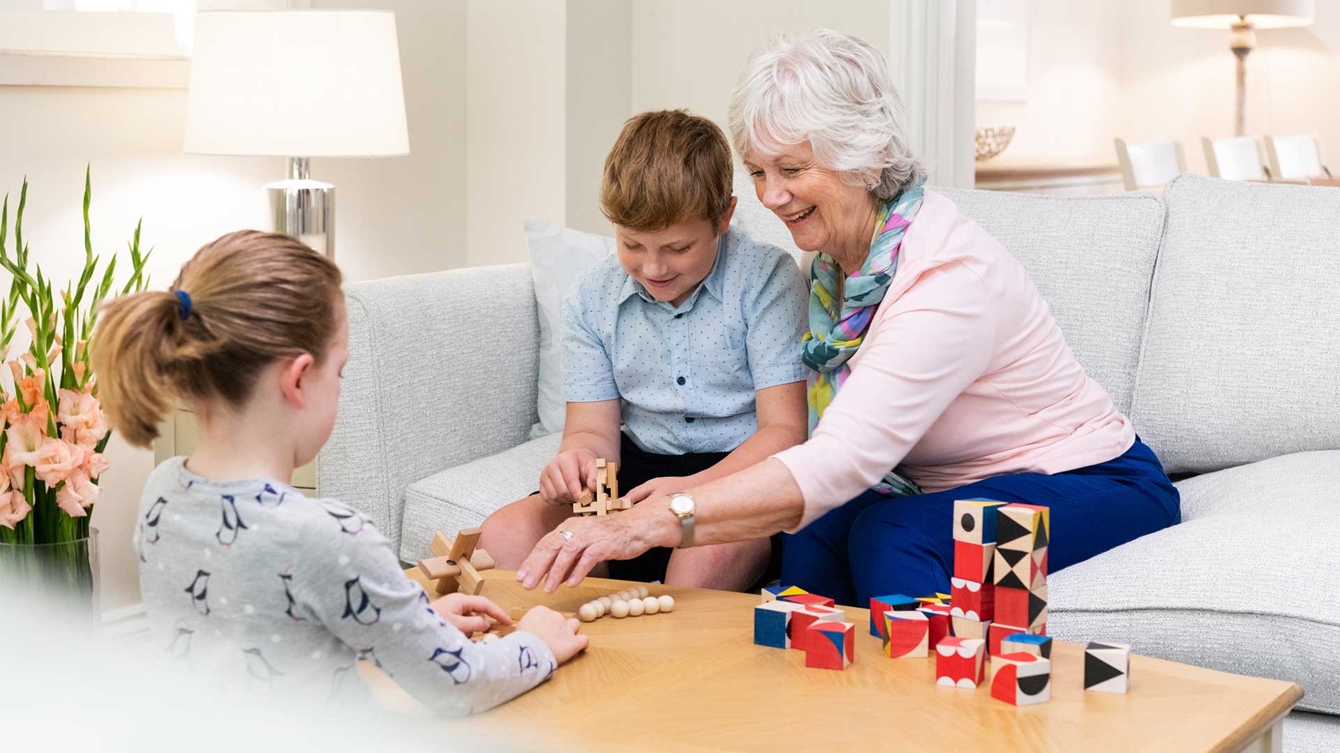 A grandmother playing games with her grandchildren