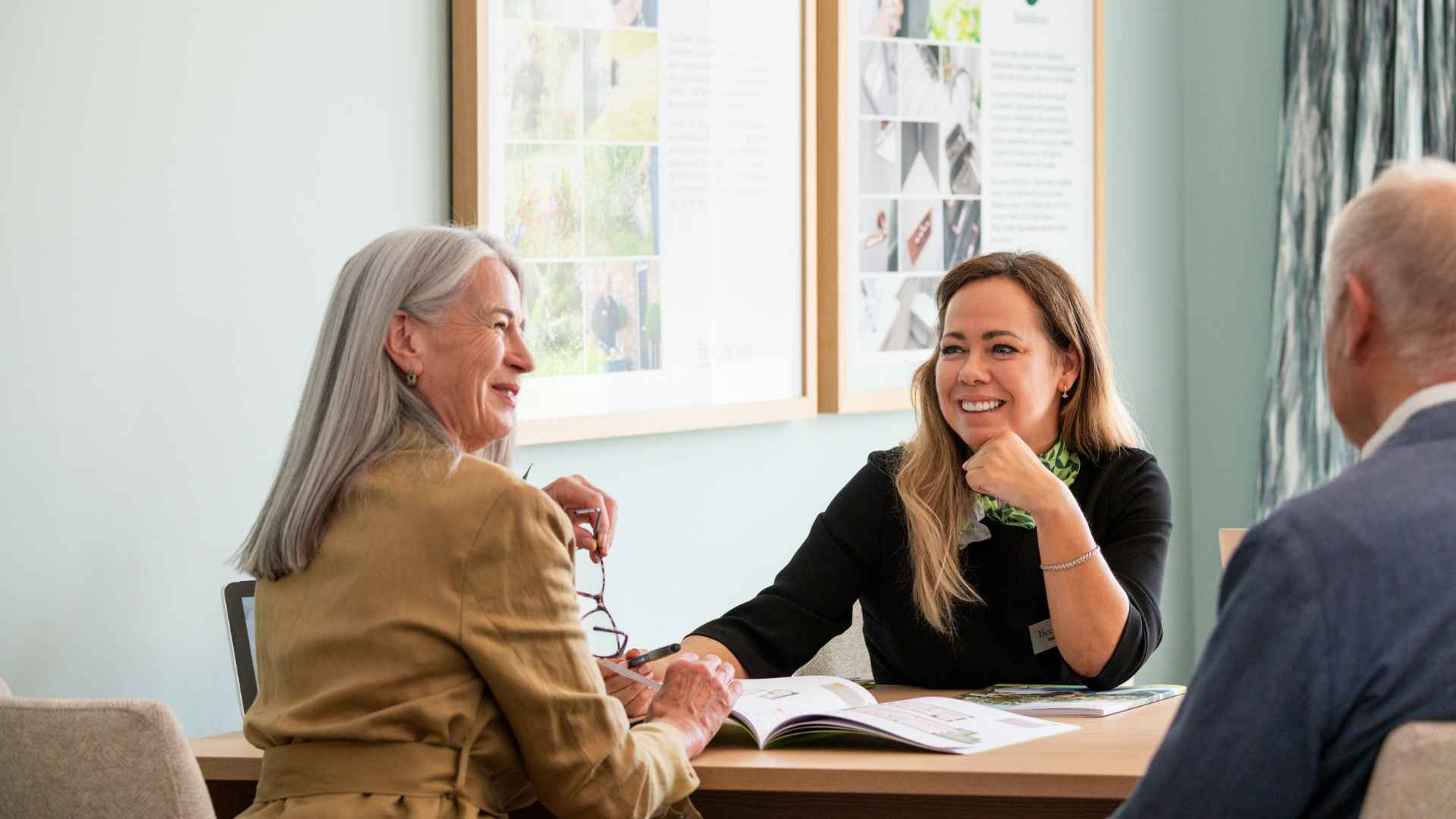 A mature couple speaking to an property company