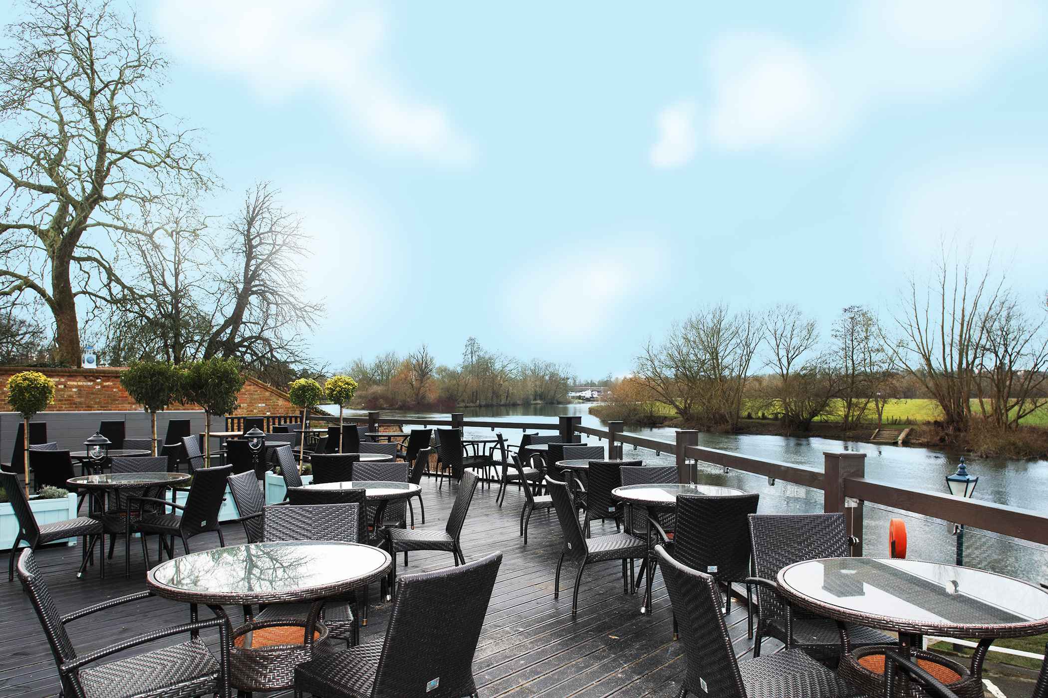With a large outdoor area, overlooking the river