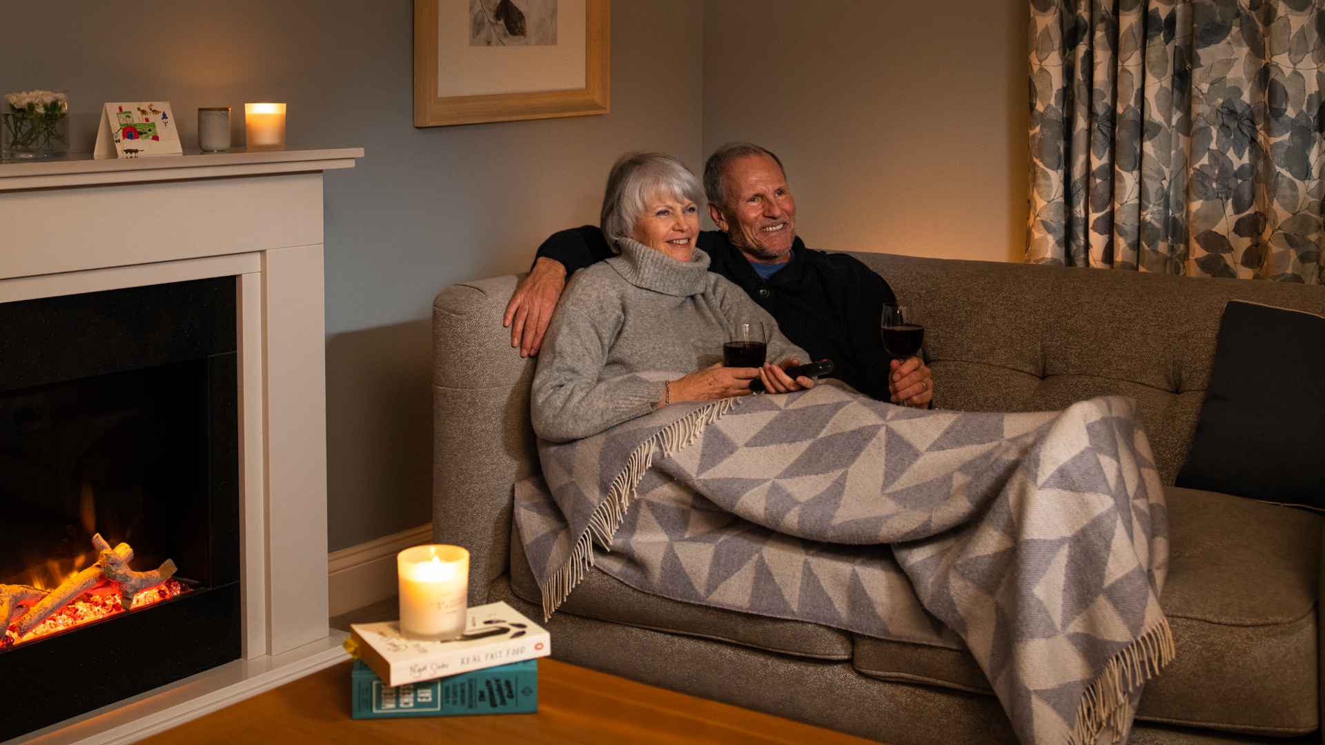 A couple drinking wine on the sofa