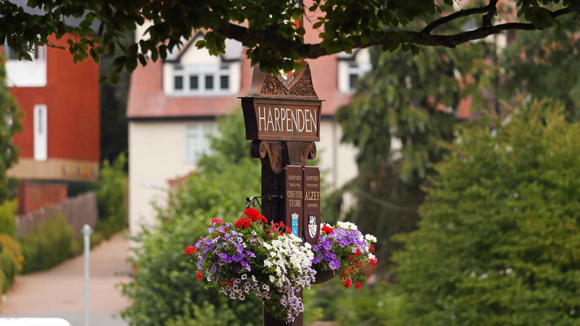The Harpenden sign with flowers