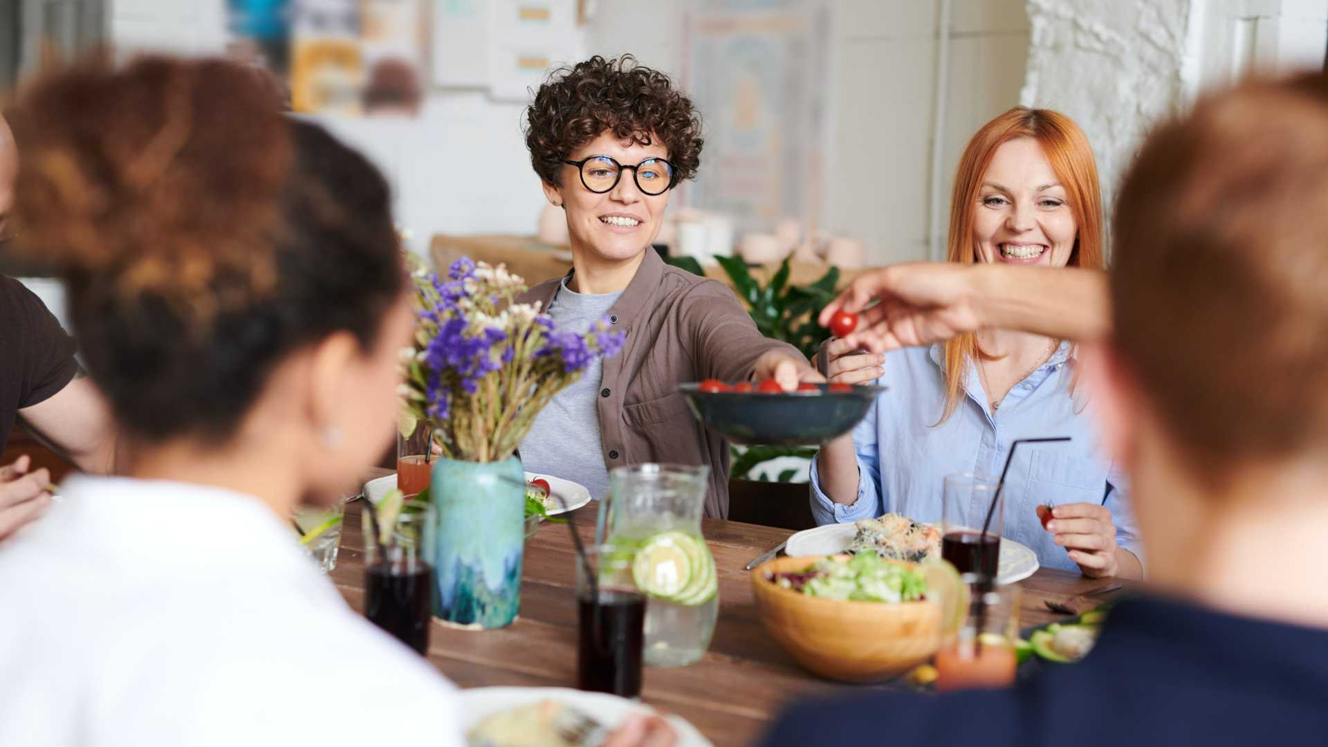 A group of ladies eating lunch together.
