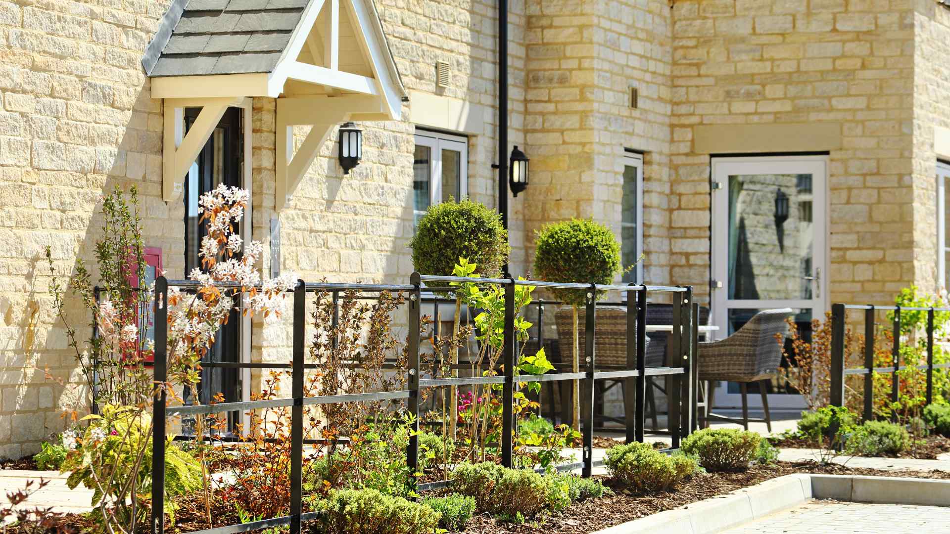A photo of the front door of a Cotswold stone cottage