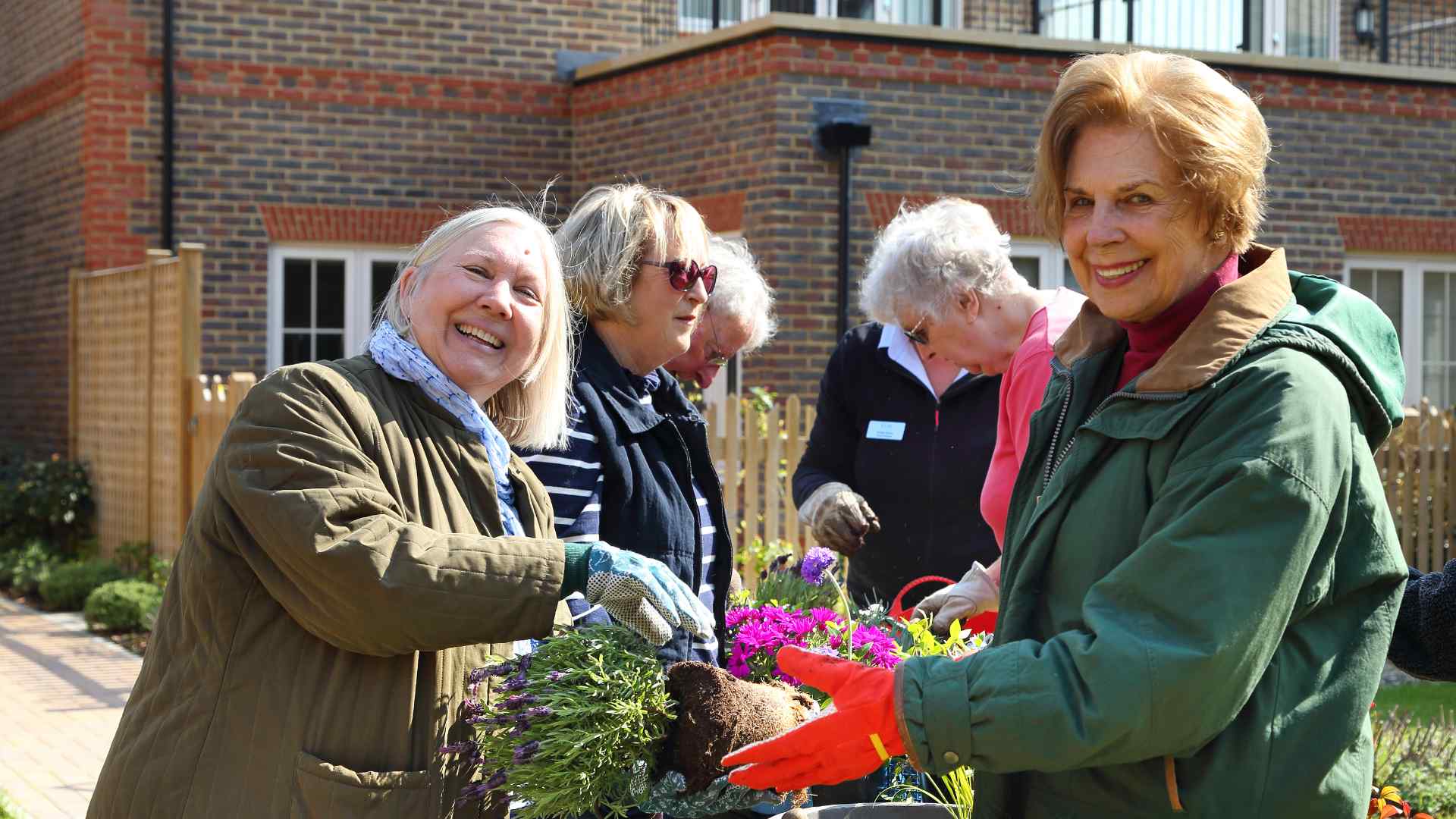 A group of people gardening together