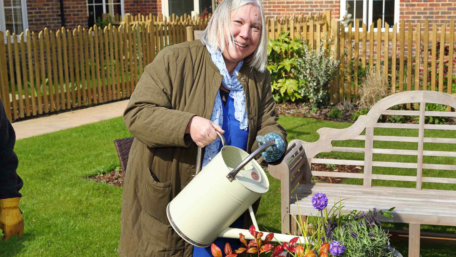 A lady with a watering can