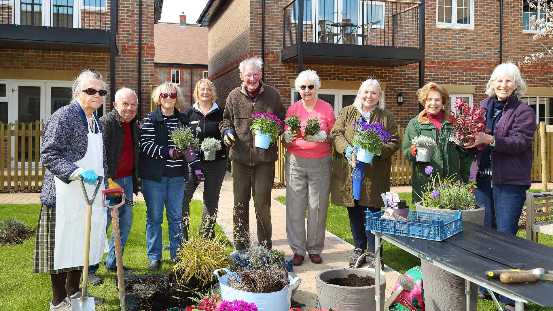 A group of retirees at Castle Gardens, Watlington at a plant potting workshop