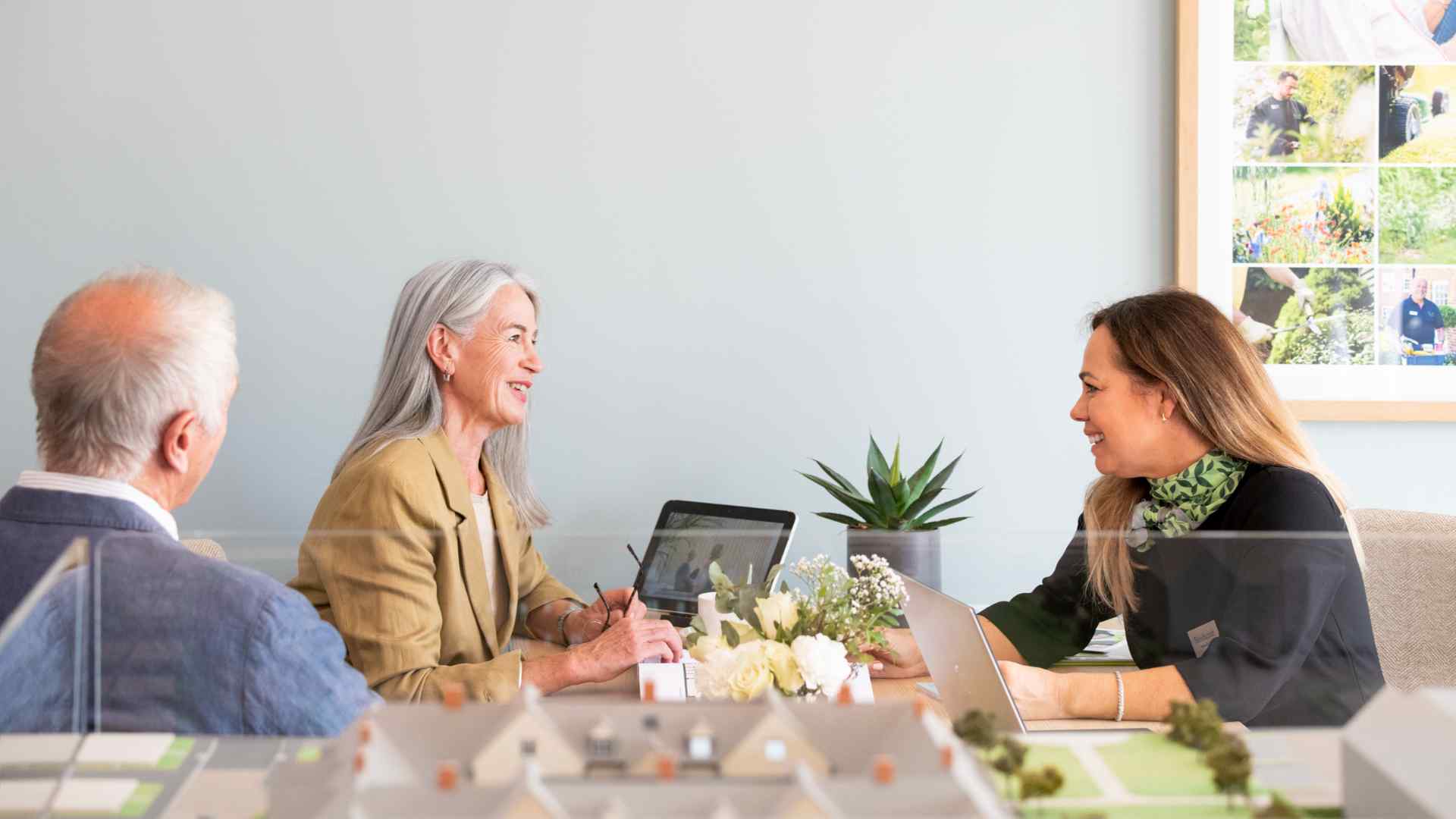A couple meeting with an estate agent
