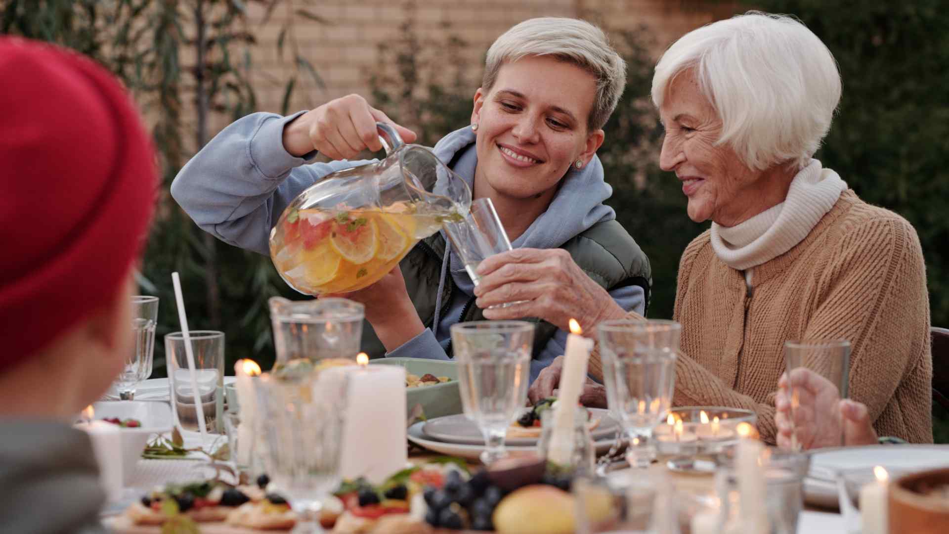 A mother and daughter drinking lemonade together