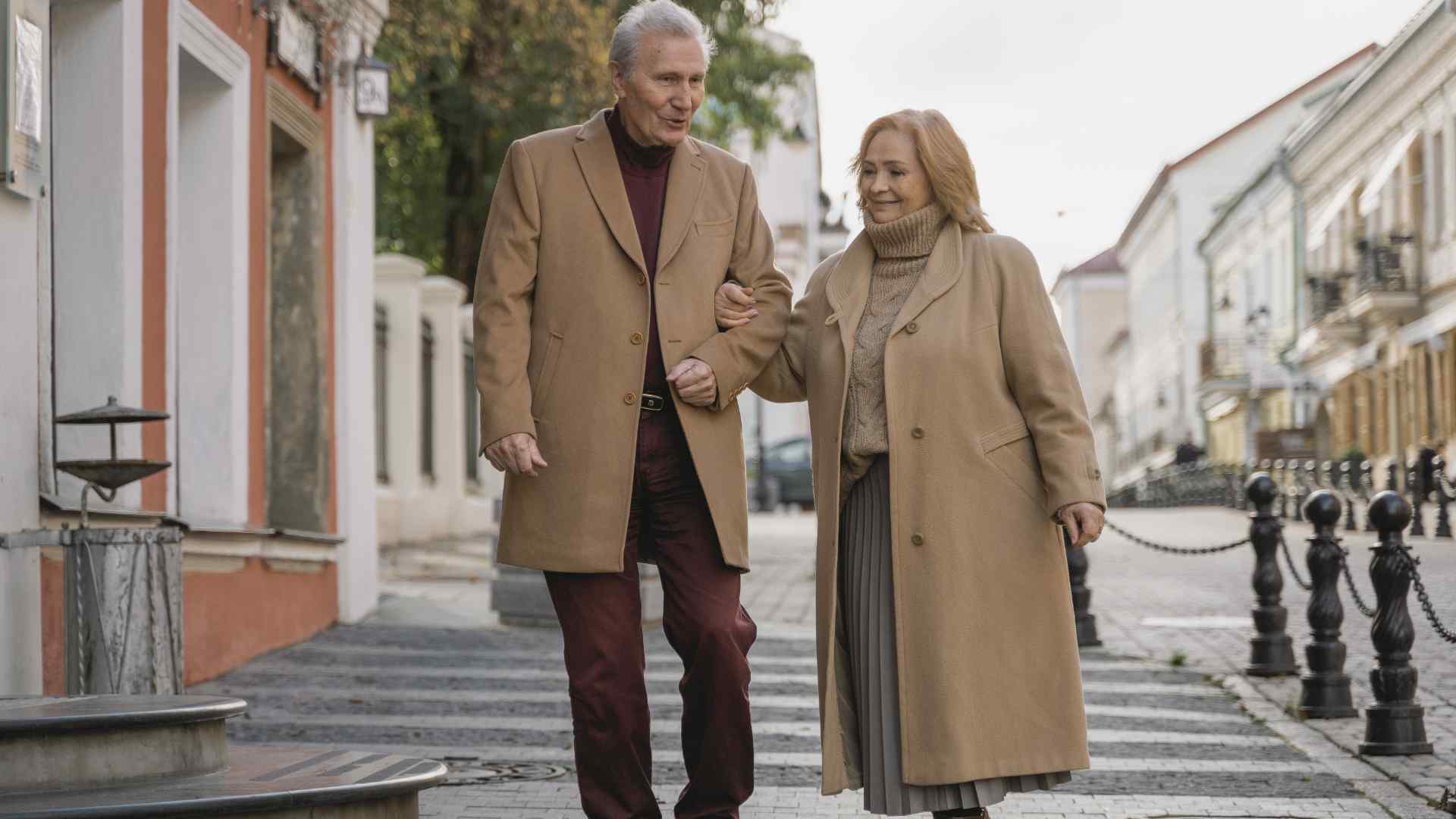 An elderly couple walking
