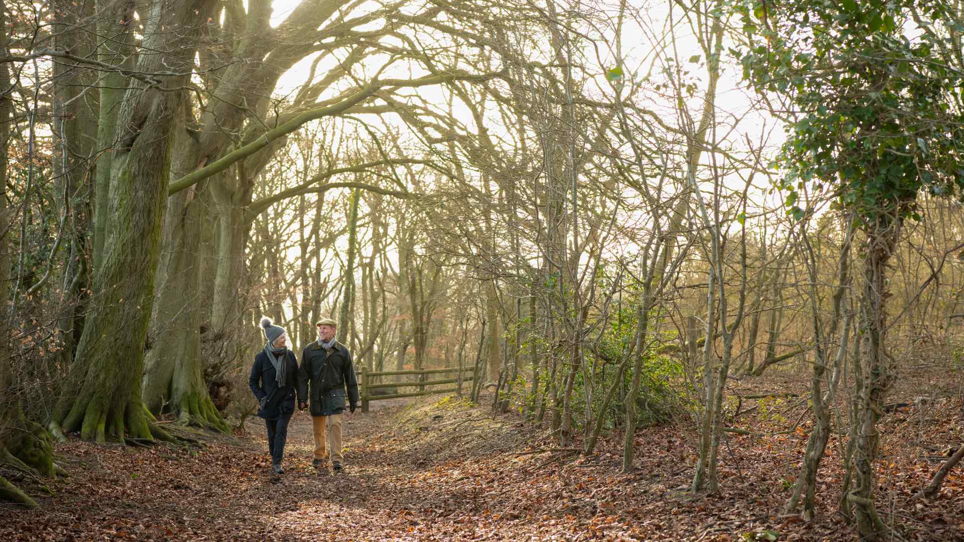 A couple walking through the woods