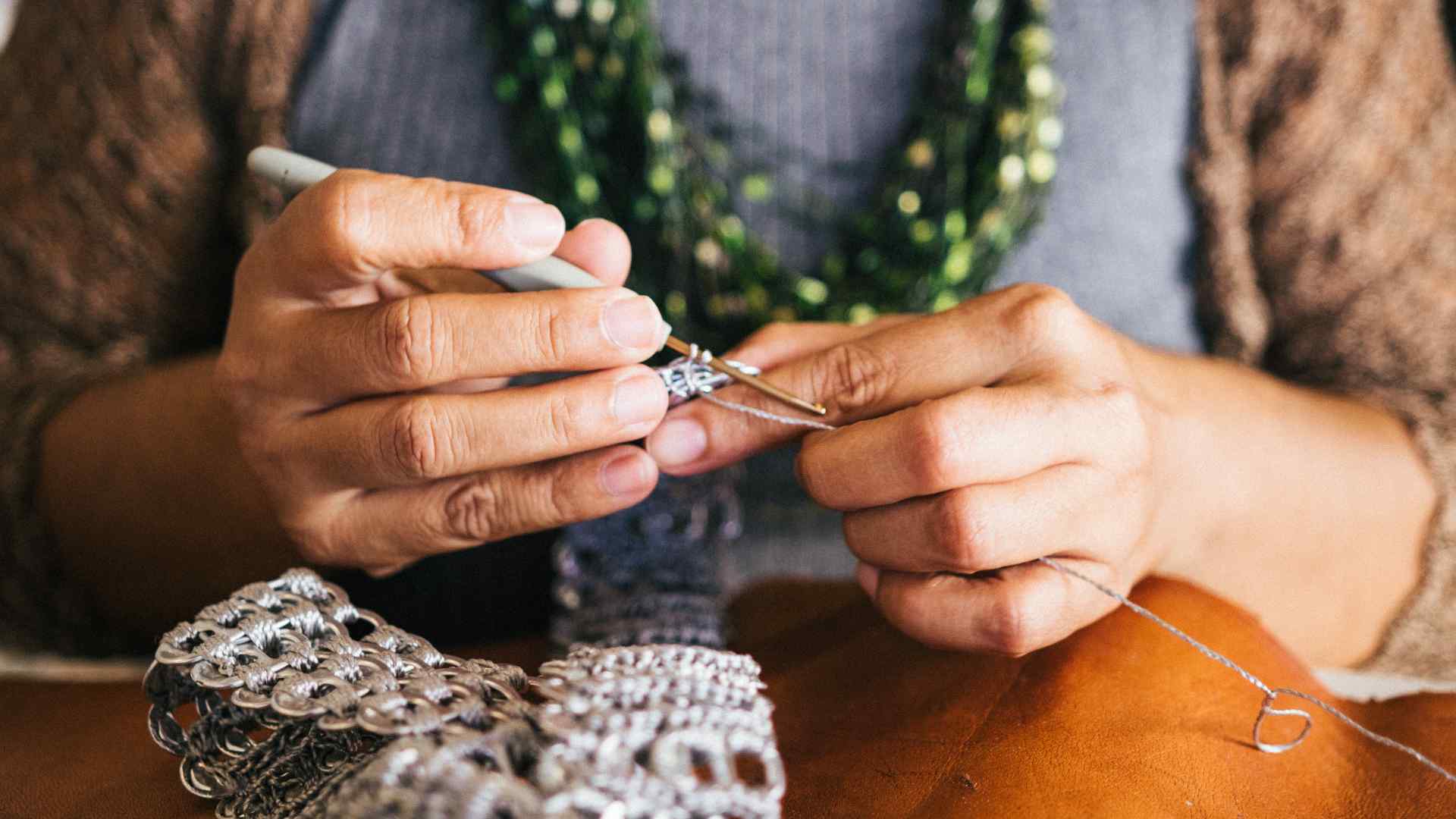 Someone knitting with needles