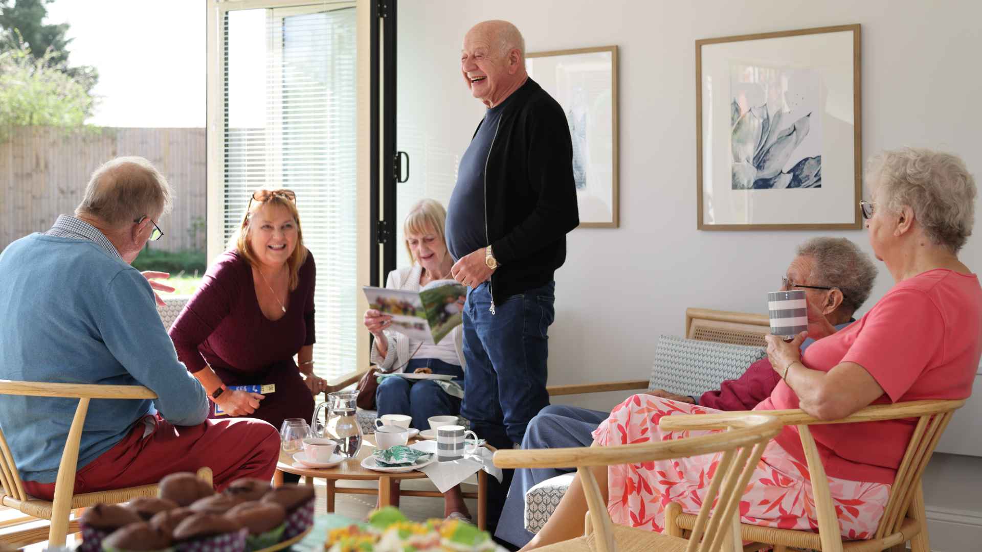 A group of people celebrating with tea