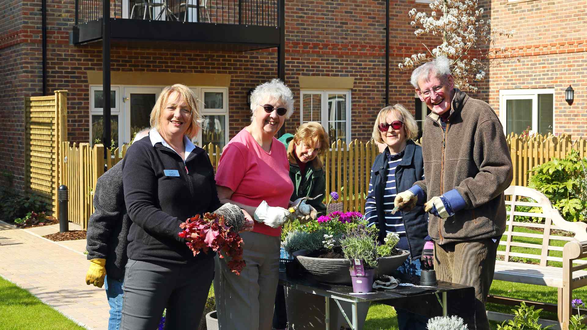 An estate manager with residents at a potting event in Watlington