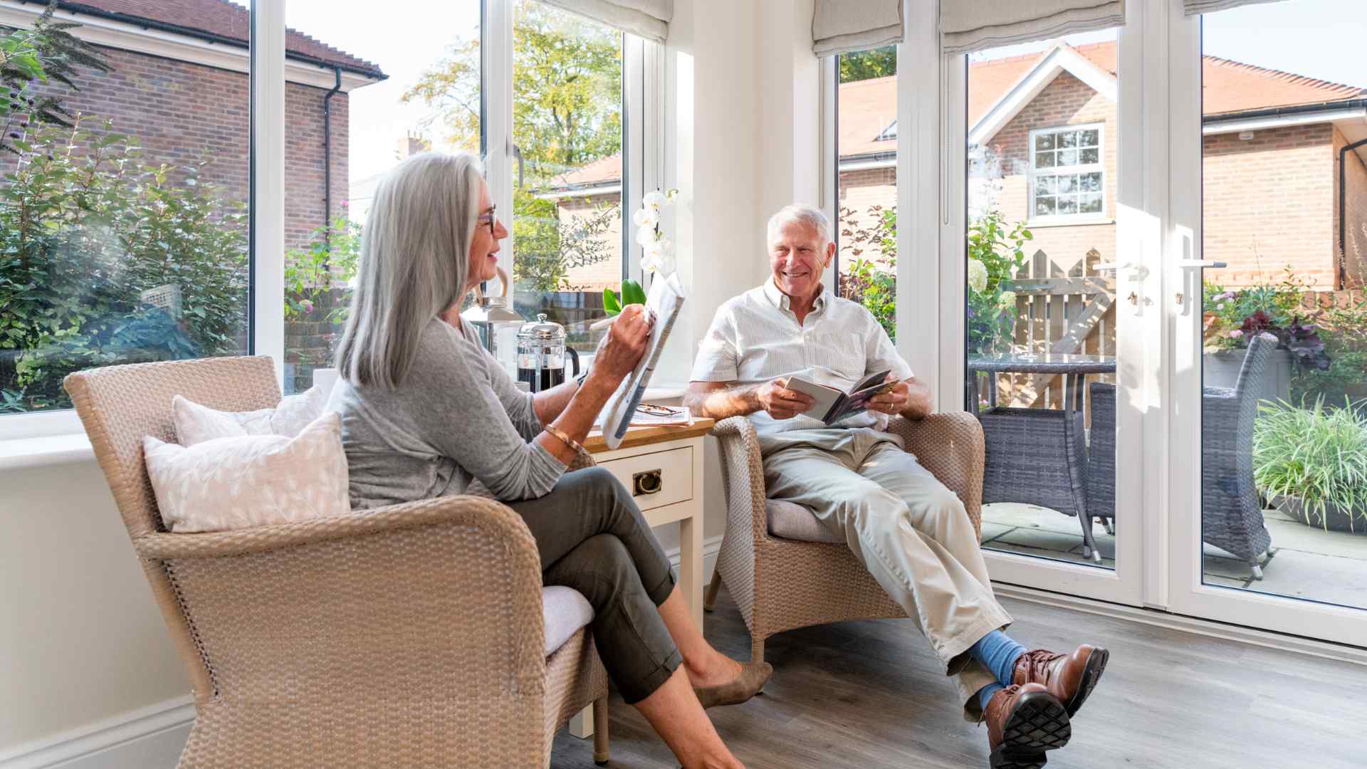 A couple sat in a sun room together